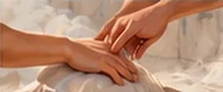 A kese mitt gliding over an arm on warm marble
