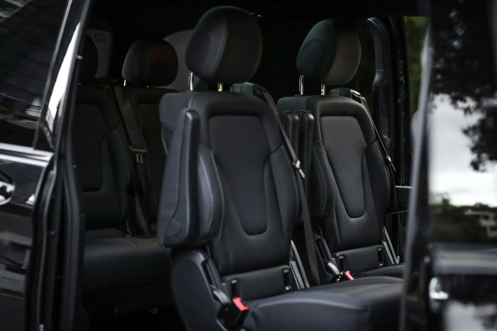 Leather seats inside a black VIP minibus